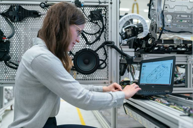 SENZAIT Testing — an engineer runs a trial at an instrumented test rig and reads the result on a laptop.